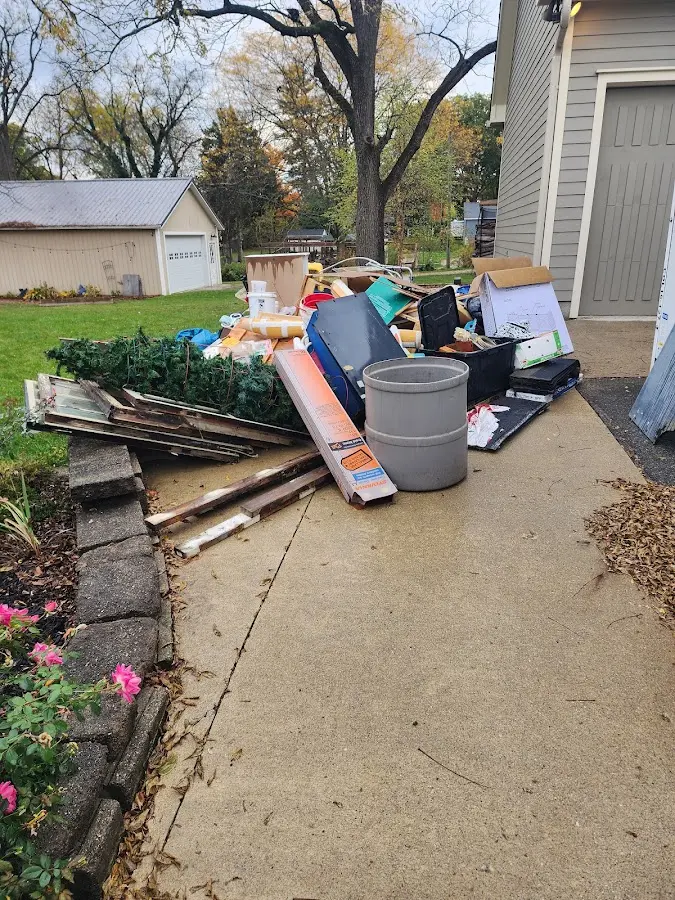 Dumpster being loaded with debris for Commercial Dumpster Rental in Taylorville